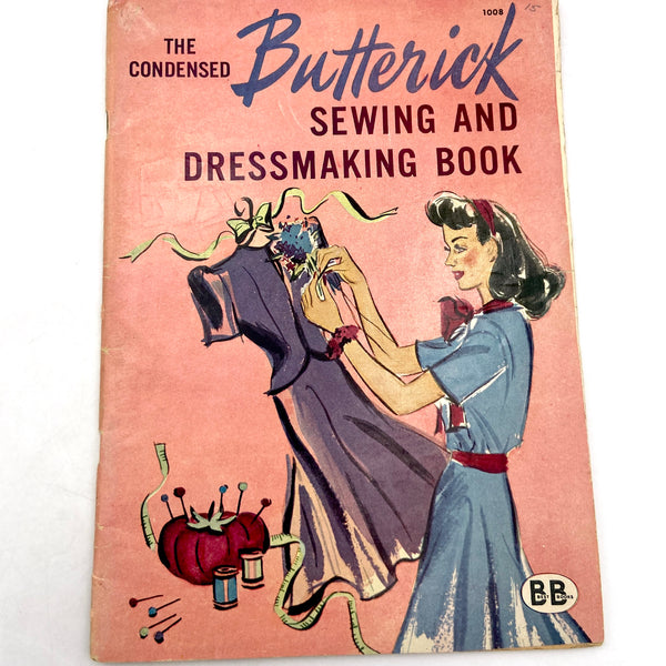 The front cover of a vintage Butterick sewing and dressmaking book.