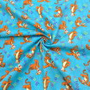 Fabric with cartoon tiger pattern on a blue background
