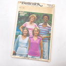 A vintage Butterick sewing pattern for adult T-shirts, showing the cover with images of women wearing T-shirts and the text 'Butterick' and '4614'.