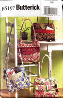 Butterick sewing pattern with fabric bags displayed on a table and chair.