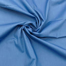 Close-up of blue fabric with folds