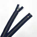 A navy-colored, non-separating metal zipper with a zipper pull and metal zipper pins visible on a white background.