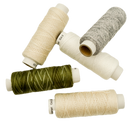 A collection of spools of Sashiko thread in various shades of beige, gray, and green.