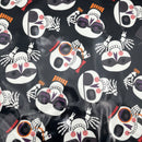 Black vinyl or plastic sheet featuring a repeating pattern of stylized Day of the Dead sugar skull faces and skeleton hands in white, black, pink, orange, and red.