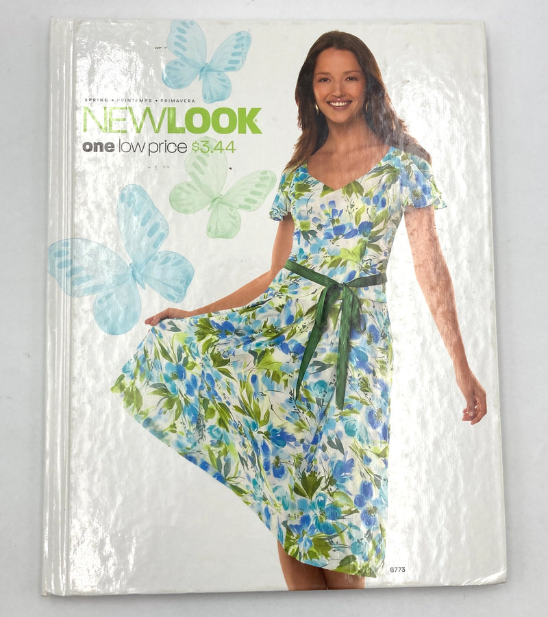 Cover of book with butterflies and a woman wearing a spring floral sundress.