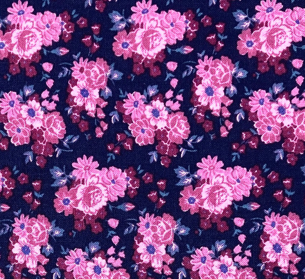 Bouquets of pink and purple flowers on a dark blue purple background.