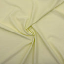 Close-up of light green fabric with folds