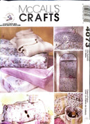 McCall's Crafts pattern book with fabric projects and packaging.