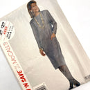 The image shows a McCall's dress pattern for sizes 6-8-10, featuring a gray dress with a V-neckline, sleeves, and a hem. 