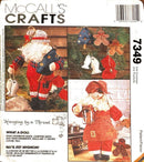 McCall's Crafts pattern packaging with Christmas-themed designs and text.