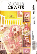 McCall's Crafts sewing pattern for baby quilt and accessories with 'suezie chic' branding.