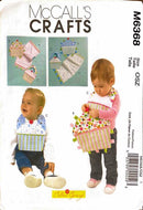 McCall's Crafts pattern M6368 for baby bibs with two babies and a close-up of the pattern pieces.