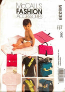 McCall's fashion accessories pattern with a child and various bags on a white background