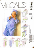 McCall's M6235 baby pattern with a baby in a blue outfit and illustrations of baby clothes.