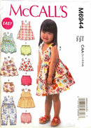 McCall's M6944 children's clothing pattern with a child model and sample outfits on a white background.