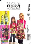 McCall's fashion accessories pattern packaging with aprons and skirts on a white background