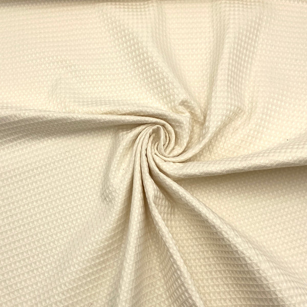 An off-white waffle weave 100% organic cotton fabric.