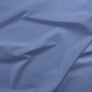 Close-up of purple blue fabric with folds
