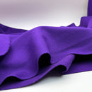 Close-up of purple wool fabric on a white background