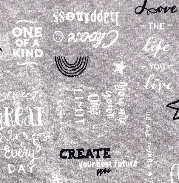 Uplifting words and phrases in white and black on a gray background