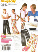 Simplicity sewing pattern leaflet for children's pants with a woman and two girls wearing the pants.