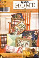 Simplicity Home sewing pattern cover with decorative pillows and a chair.