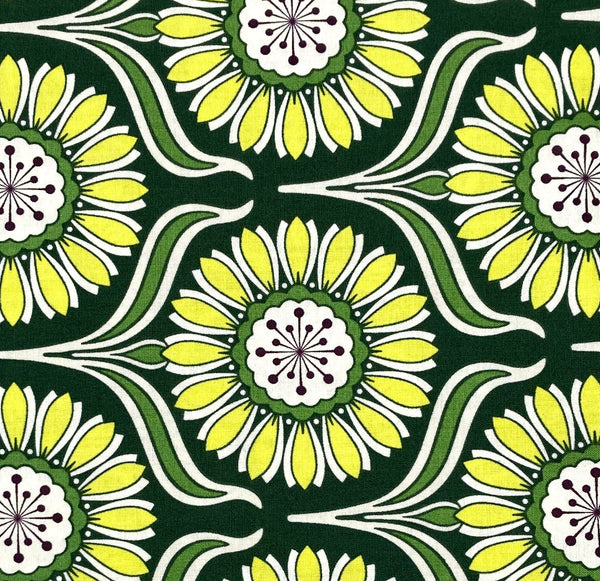 Bold yellow flowers on a dark green background. 100% cotton quilting fabric. 