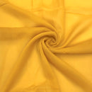 Close-up of yellow fabric with a swirl pattern