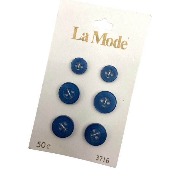 A set of 6 blue plastic buttons in two different sizes. 