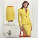 A printed fabric pattern for a yellow adult petite jacket and skirt set, featuring a image of the finished product and the brand name Anne Klein at the top.