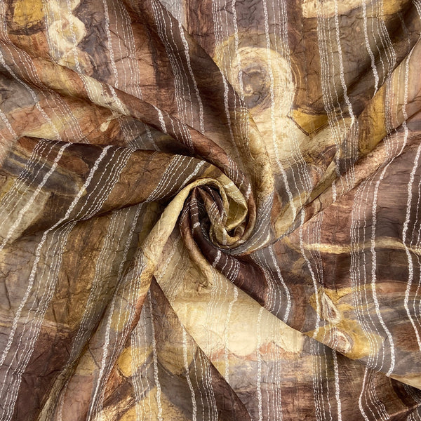 A synthetic chiffon in shades of brown with a stitched embroidery detail.