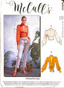 McCall's sewing pattern envelope for pattern number 48043, size EU 14-16-18-20-22, featuring a model wearing a sheer orange long-sleeve top and light blue jeans, alongside flat pattern illustrations labeled A and B of matching tops.