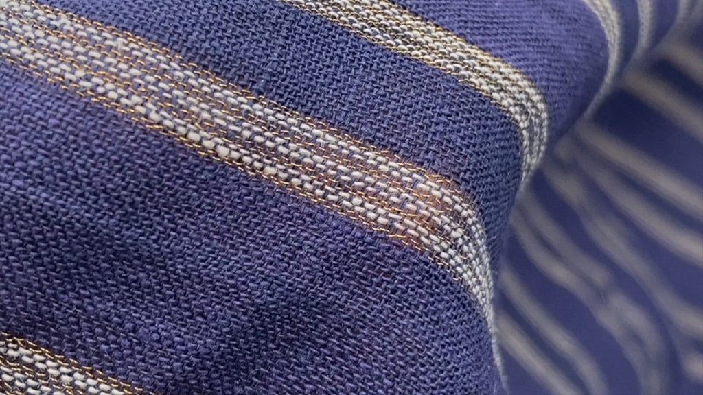 A video showing the texture, opacity, and drape of this navy blue fabric with gold and white stripes throughout.