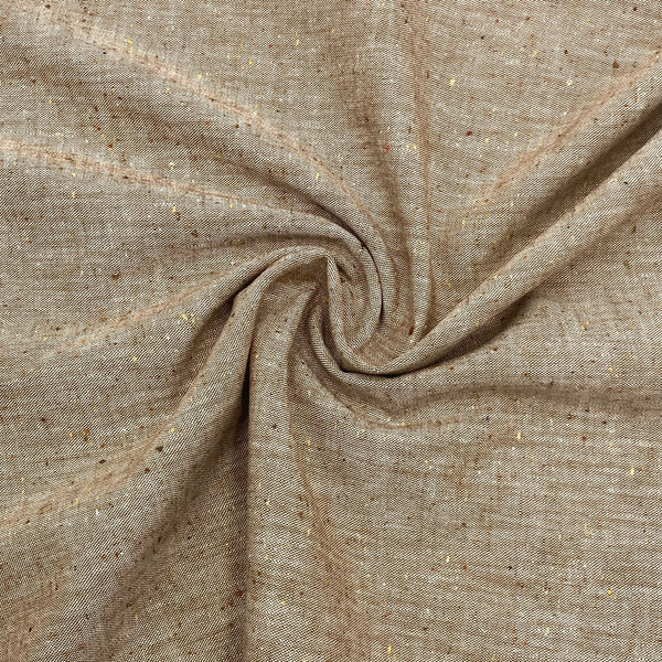 A brown speckled chambray fabric is scrunched in a swirl pattern to better show the thickness and texture of the fabric.