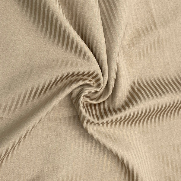 A tan fabric with tonal stripes woven in twill and satin weave.