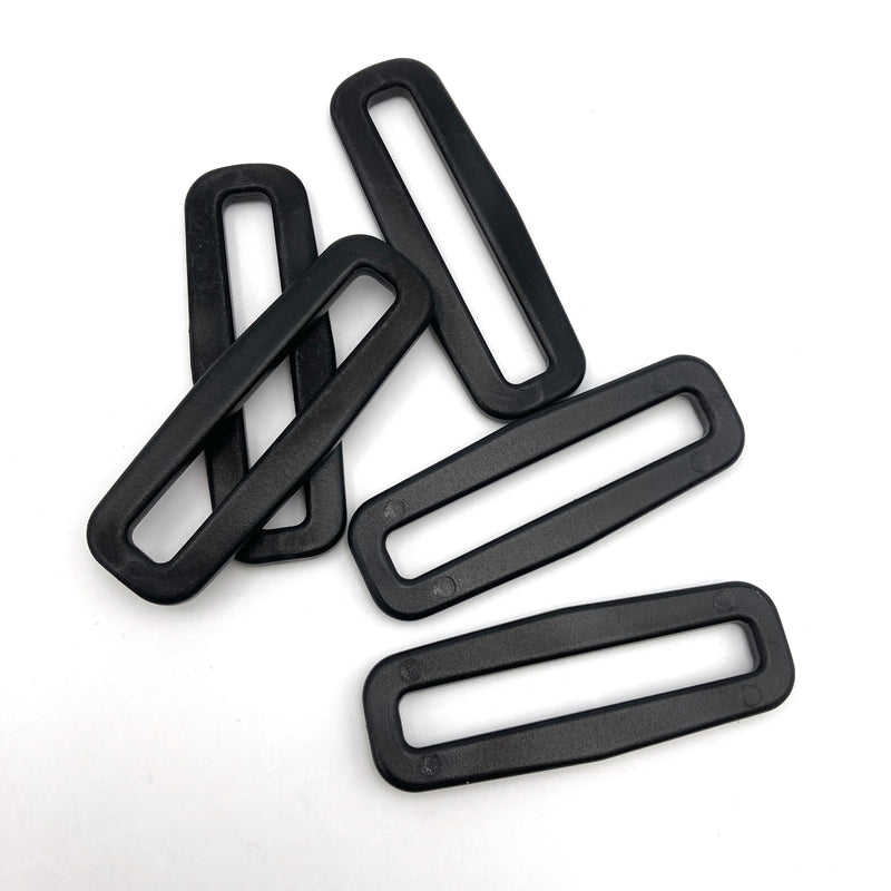 black plastic rectangular slides made for bag straps and similar applications