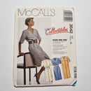 McCall's easy collectibles pattern 3542 for a sleeveless adult dress and belt, showing the cover with a woman sitting wearing the dress, along with illustrations of the dress and belt on mannequins.