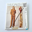 McCall's adult lined jacket, pants, and skirt sewing pattern in a brown color, size 8 or 10, with a model wearing the outfit on the cover.