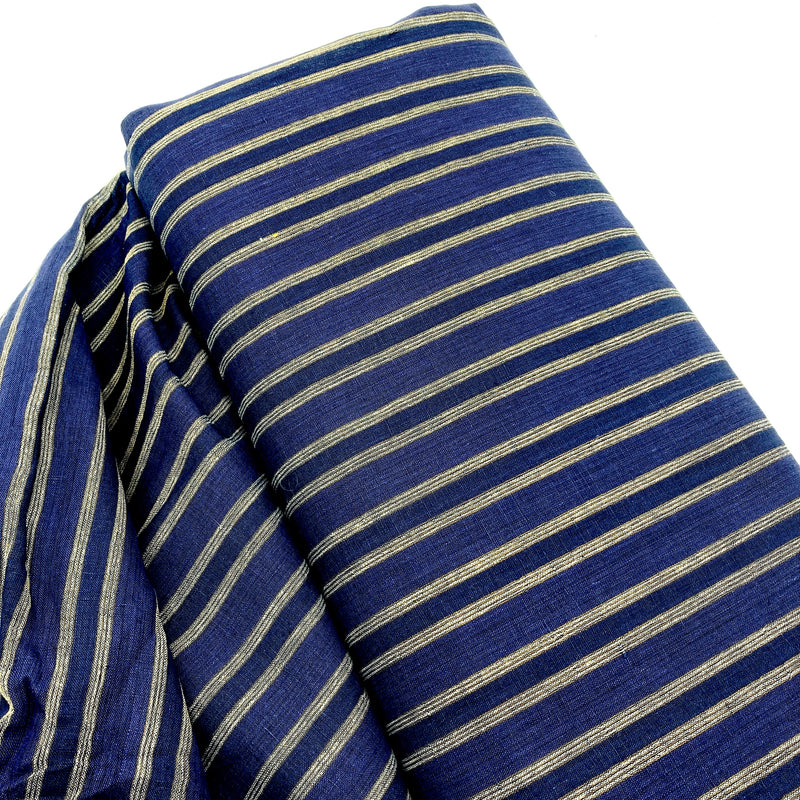 A bolt of navy blue linen fabric with stripes laying on a white table.